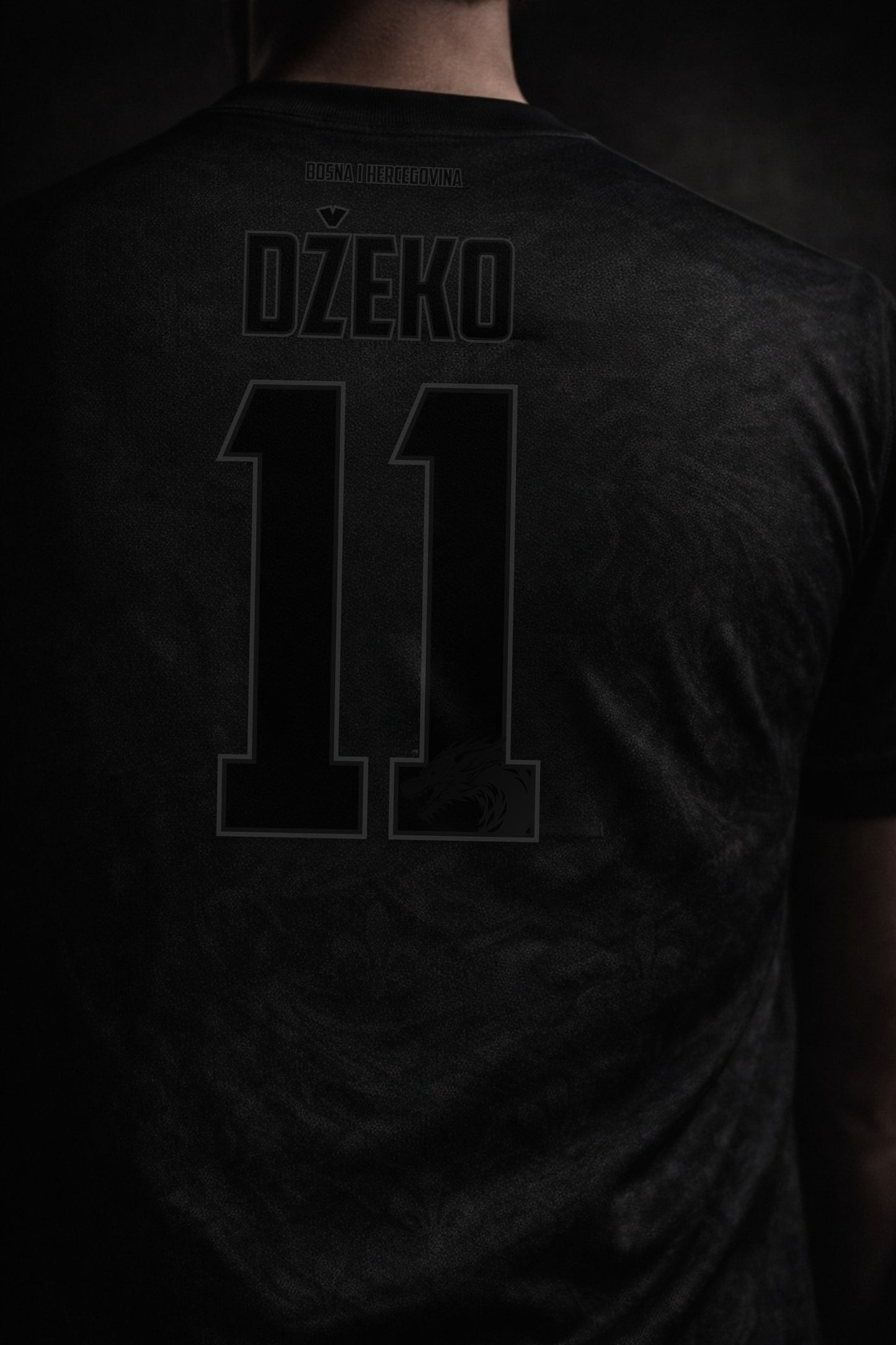 Black sports jersey with 'Džeko' and number '11' on the back