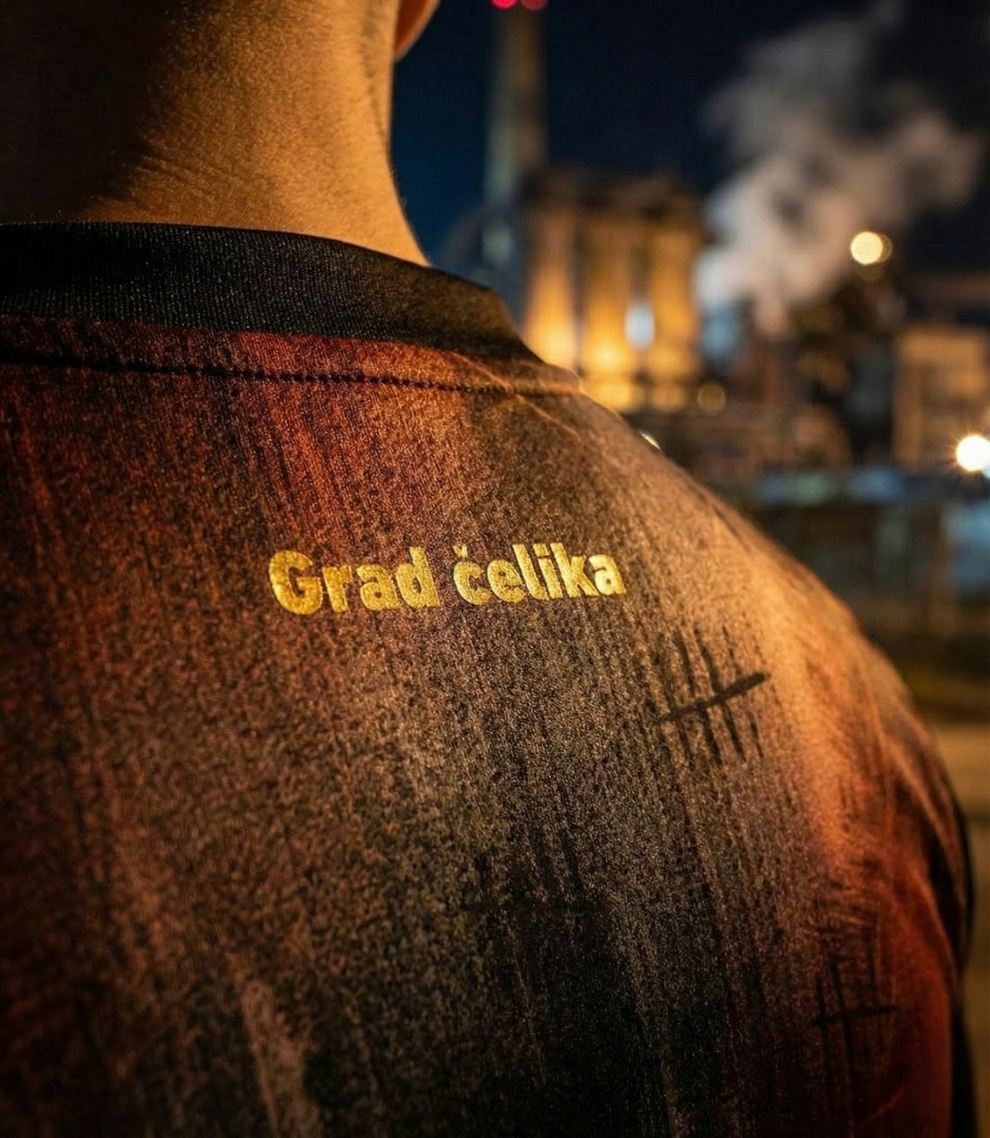 Zenica concept football jersey featuring black and red industrial pattern inspired by steelworks, with Grad Celika gold text on the back.
