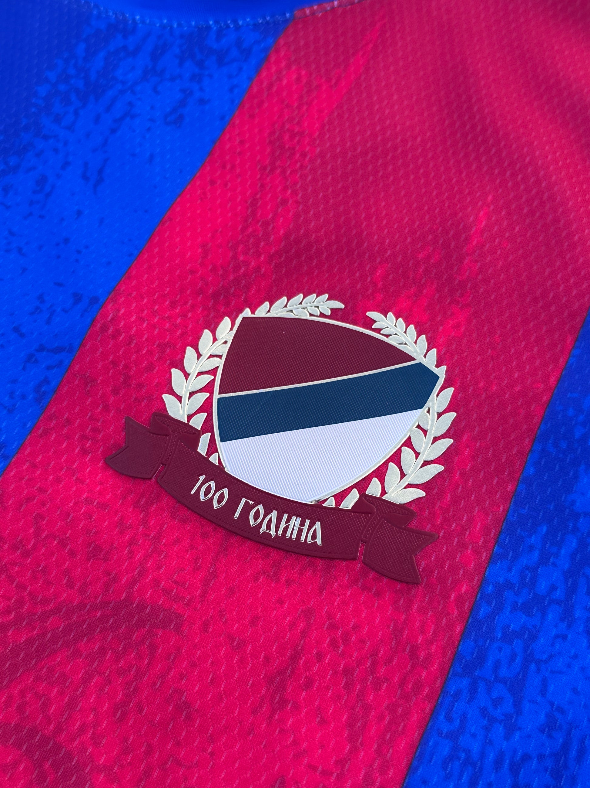 Close-up of a Borac Banja Luka red and blue sports jersey with a logo and text