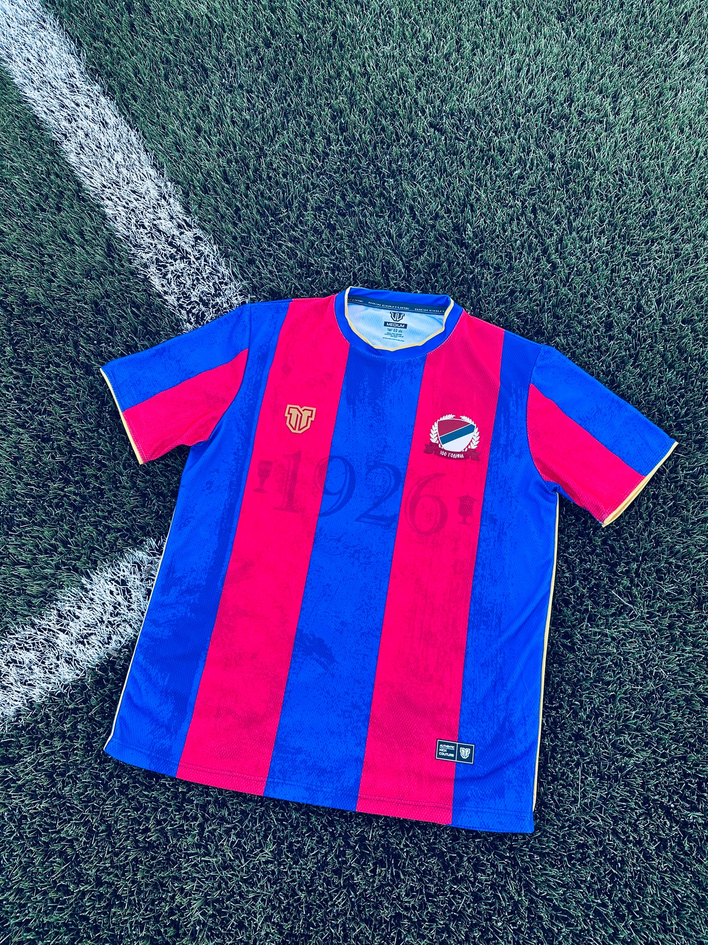 Close-up of a Borac Banja Luka concept red and blue sports jersey with logos and text.