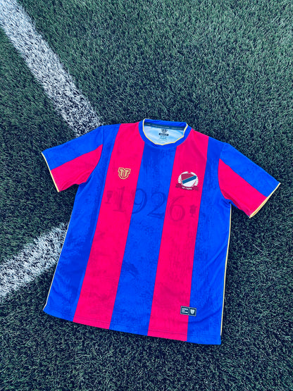 Close-up of a Borac Banja Luka concept red and blue sports jersey with logos and text.